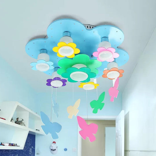Blue Blossom Ceiling Mount Light With Hanging Butterfly: 7-Head Wood Lamp For Child Bedroom