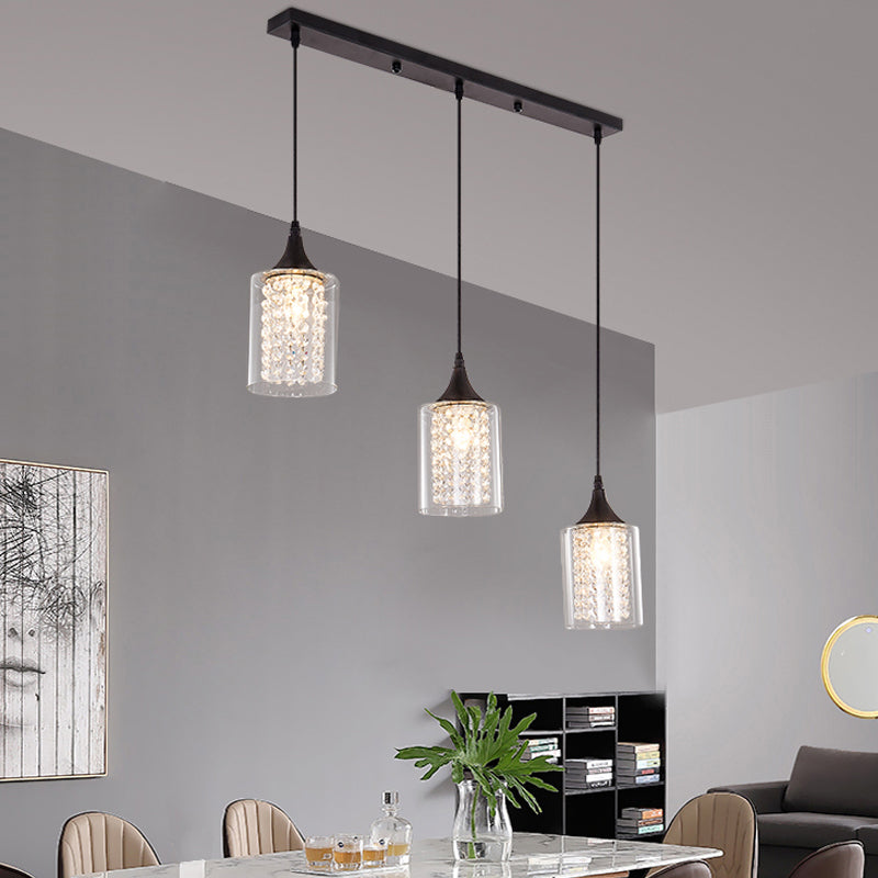 Minimalist Black Pendulum Lamp With 3-Light Clear Glass Cylinder And Linear/Round Canopy