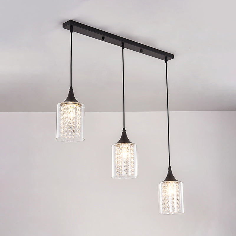 Minimalist Black Pendulum Lamp With 3-Light Clear Glass Cylinder And Linear/Round Canopy