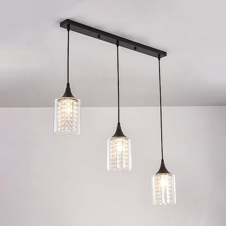 Minimalist Black Pendulum Lamp With 3-Light Clear Glass Cylinder And Linear/Round Canopy