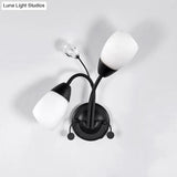Black Tulip Wall Sconce With Ivory Glass And Crystal Accent