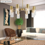 Contemporary 8-Light Brass Chandelier With Clear Glass Shade