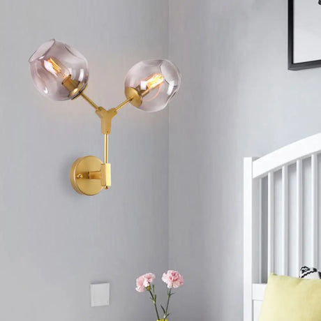Contemporary Black/Gold Wall Sconce With Oval Amber/Gold/Clear Glass Shade - Elegant Half-Light