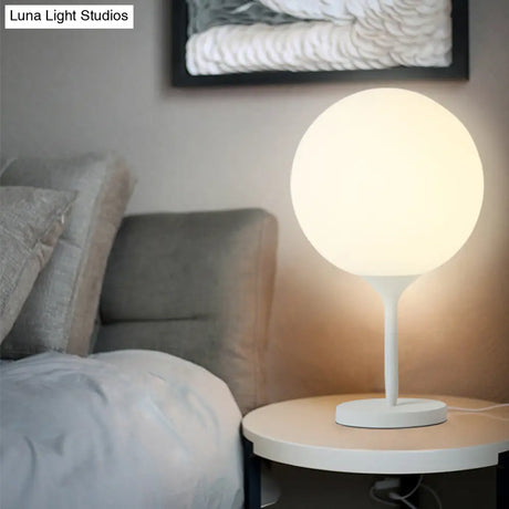 Contemporary White Bedside Table Lamp With Globe Cream Glass Shade - 1 Light