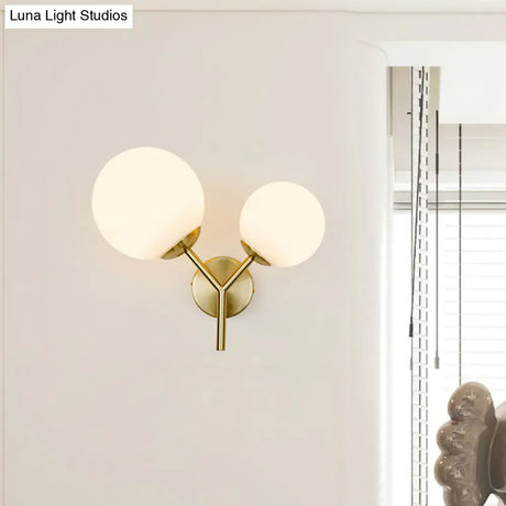 Contemporary White Glass Spherical Sconce With 2 Gold Heads - Wall Mounted Light Fixture