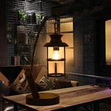 Farmhouse Bronze Finish Table Lamp With Metal Curved Arm And Clear Glass Shade