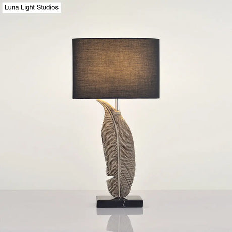 Feather Base Nightstand Lamp In Black With Classic Drum Shade For A Cozy Bedside Ambiance