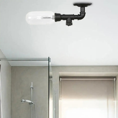 Industrial Black Ceiling Mounted Fixture - Oval Clear Glass Shade Semi Flush Mount With Pipe Design