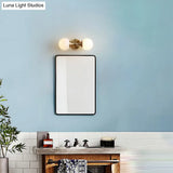 Ivory Glass Ball Wall Lamp With 2-Head Brass Sconce For Bedroom