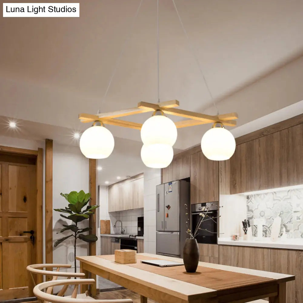Japanese Style 4-Bulb Cream Glass Sphere Pendant Chandelier For Living Room In Wood