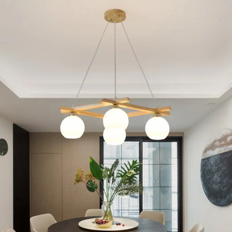 Japanese Style 4-Bulb Cream Glass Sphere Pendant Chandelier For Living Room In Wood