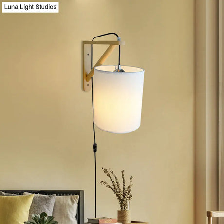 Japanese Style Cylindrical Fabric Wall Sconce With 1-Bulb And Wood Mount