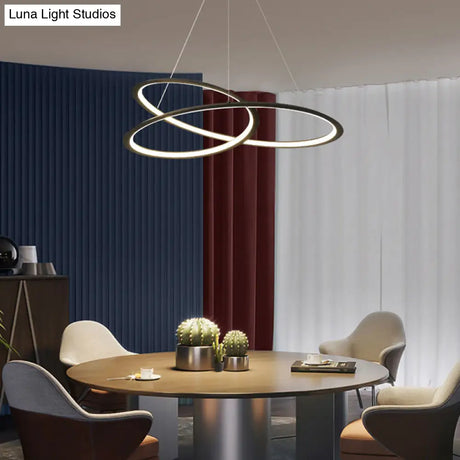 Metal Led Chandelier: Sleek Seamless Curves For Minimalistic Dining Room Lighting