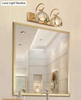 Mid-Century Style Brass Vanity Sconce With Glass Shade For Bathroom Lighting