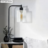 Modern Black Cylindrical Night Table Lamp With Clear Glass Shade For Bedroom