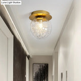 Modern Gold Pumpkin Ball Flush Light Fixture With Clear Glass Shade And Metal Line Inside