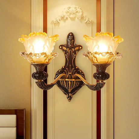 Rustic Half-Head Wall Lamp With Curvy Metallic Design And Flower Amber Glass Shade - Brass Finish 2