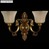 Traditional Bronze 2-Bulb Wall Sconce With Curved Arm And Bell White Glass Shade