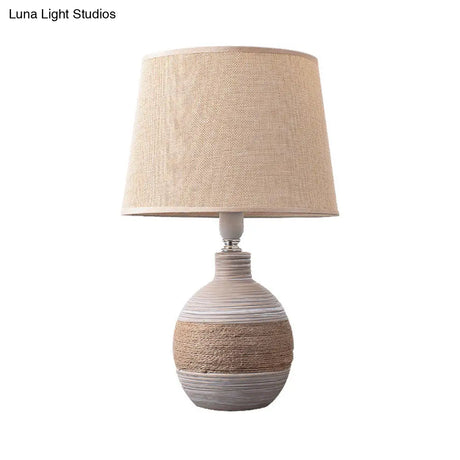 Traditional Flaxen/Grey Nightstand Lamp With Ceramic Base - 1-Light Fabric Drum Desk Light