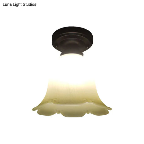 White Glass Flush Mount Ceiling Light With Black Base And Cottage Flower Design